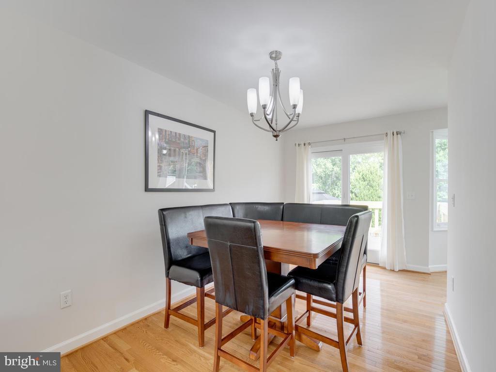 976 Pebblestone Road Pasadena, MD 21122 - Photo 7 of 39 Dining room leads to deck