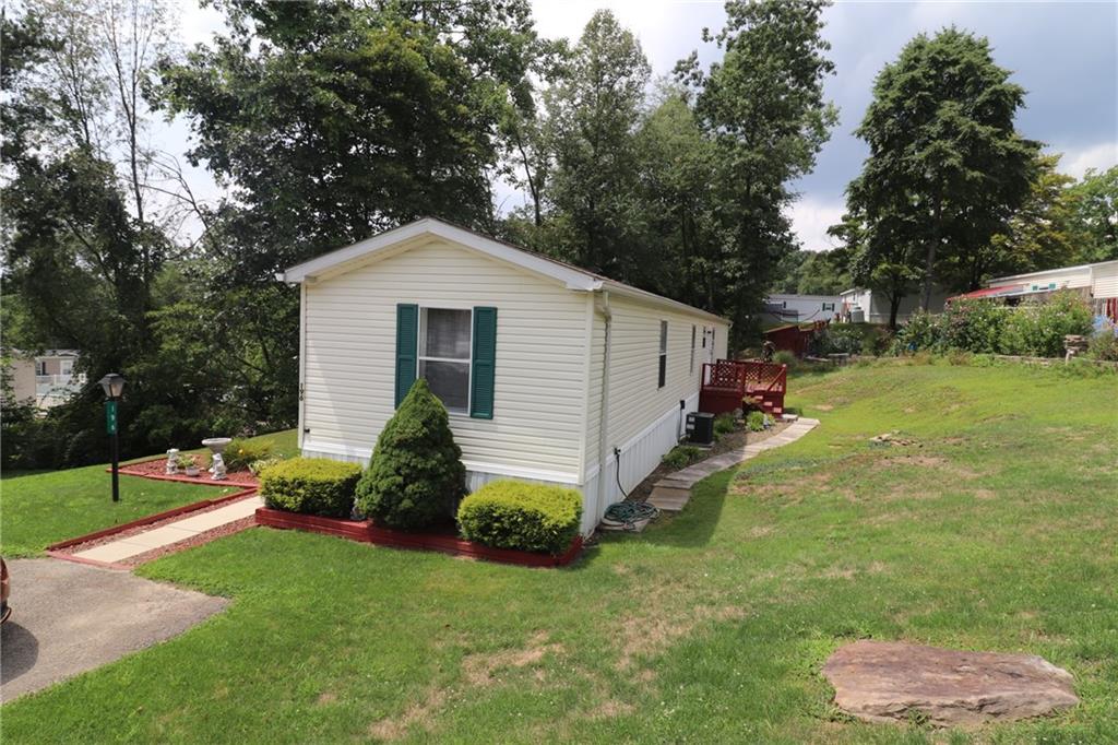 196 Tanner Street Export, PA 15632 - Photo 1 of 23 a front view of a house with garden