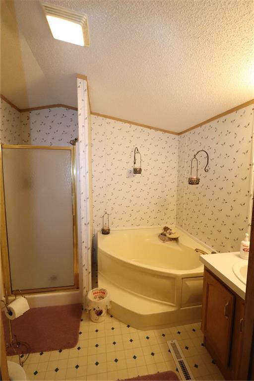 196 Tanner Street Export, PA 15632 - Photo 11 of 23 a bathroom with a bathtub and a shower