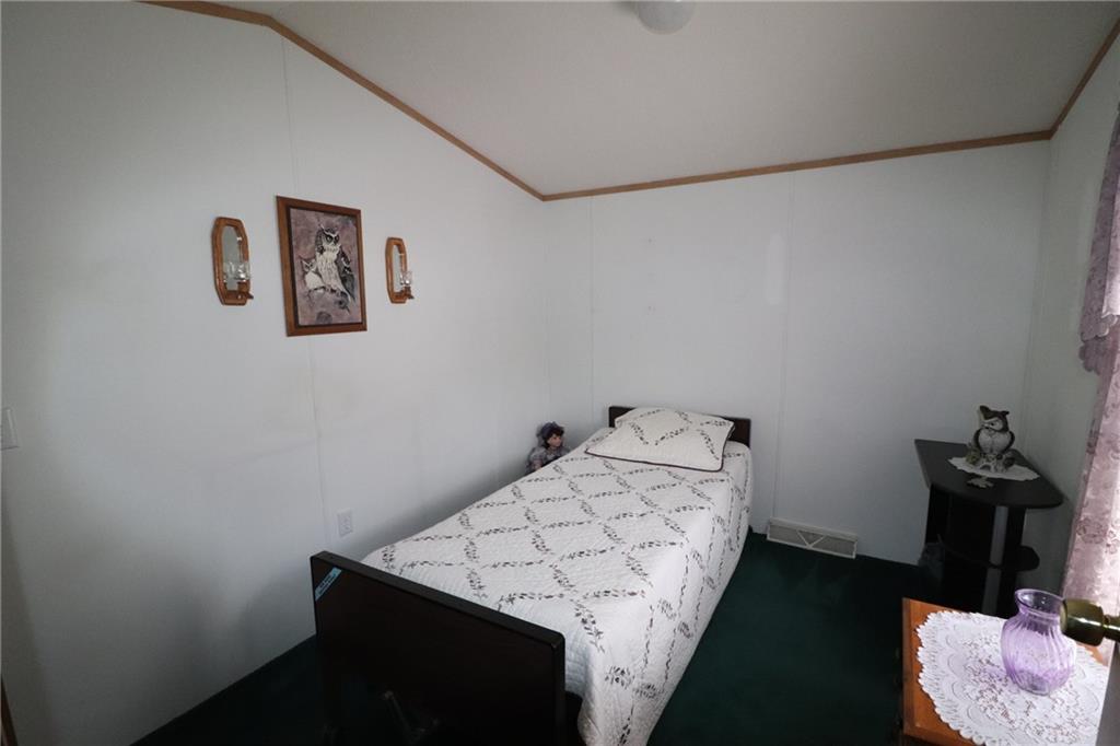 196 Tanner Street Export, PA 15632 - Photo 14 of 23 a bedroom with a bed and cabinets