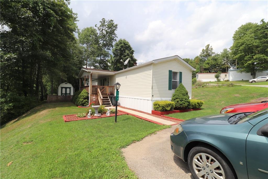 196 Tanner Street Export, PA 15632 - Photo 2 of 23 a front view of a house with garden
