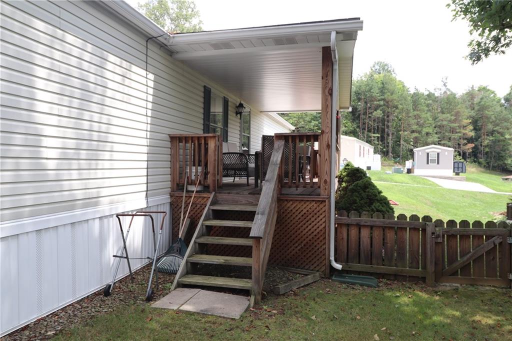 196 Tanner Street Export, PA 15632 - Photo 3 of 23 a view of a deck with wooden fence and a stairs