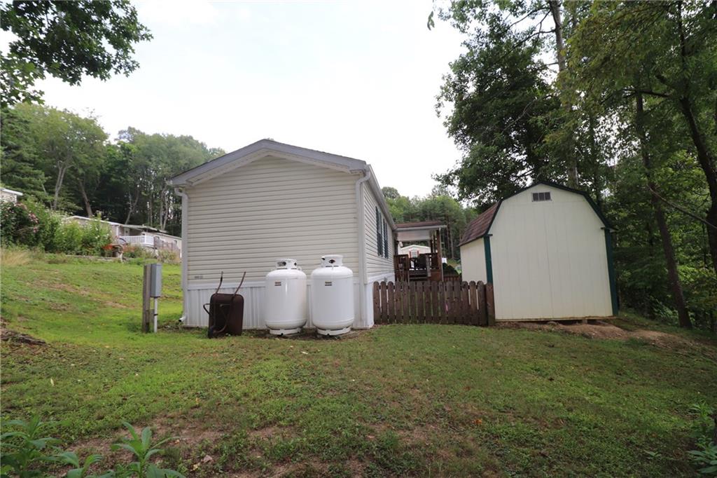 196 Tanner Street Export, PA 15632 - Photo 4 of 23 a backyard of a house with table and chairs