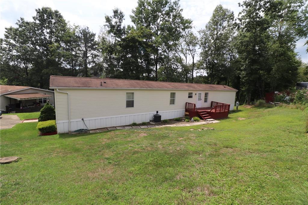 196 Tanner Street Export, PA 15632 - Photo 6 of 23 a view of a backyard with a house and a large tree