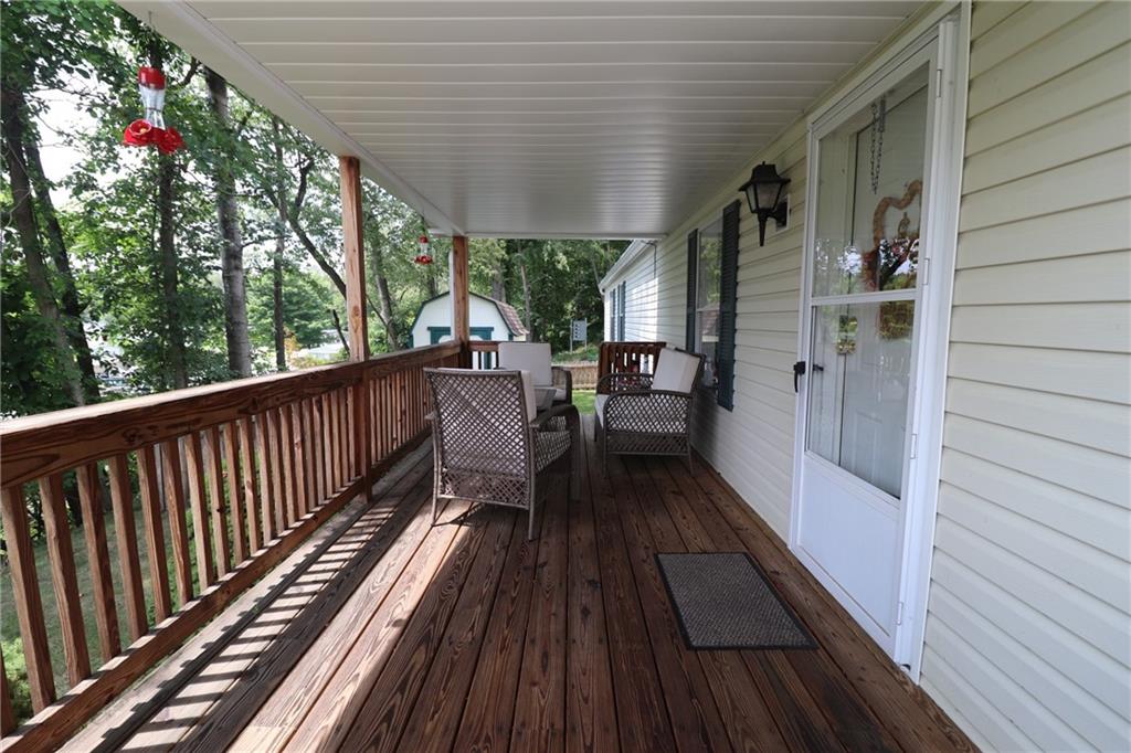 196 Tanner Street Export, PA 15632 - Photo 8 of 23 a view of balcony with wooden floor and outdoor seating