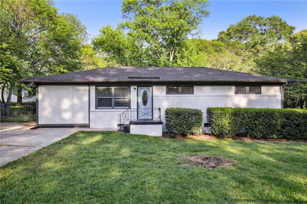 2545 Walton Way Southwest Marietta, GA 30060 - Photo 1 of 1 a front view of a house with a yard