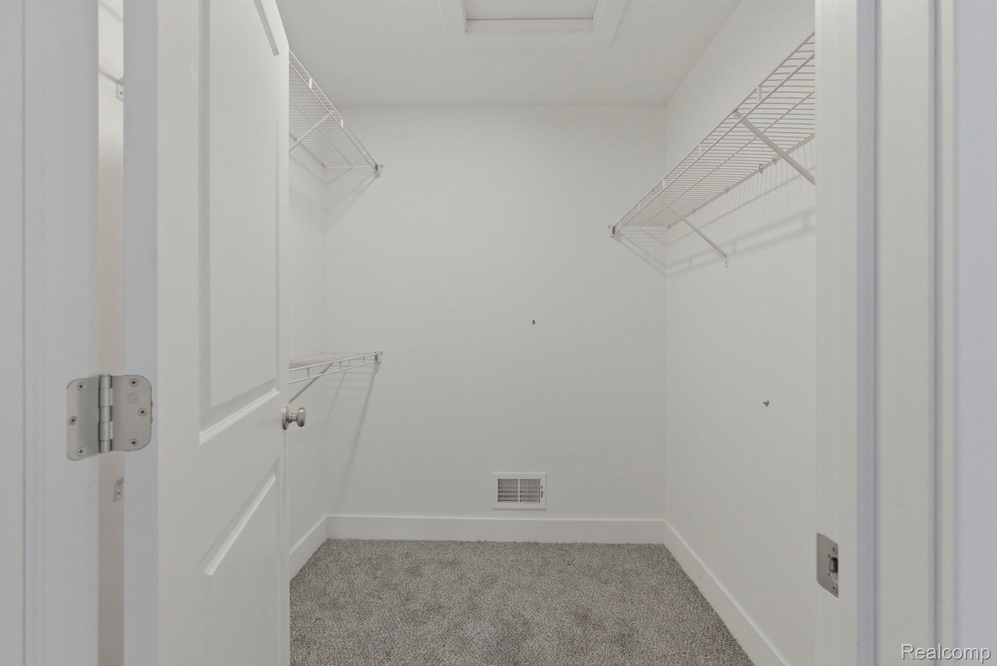 2281 Baltimore Davison, MI 48423 - Photo 15 of 26 Walk in closet featuring light colored carpet