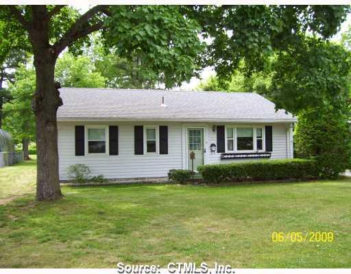 201 Southwest Windsor Locks Windsor Locks, CT 06096 - Photo 1 of 1 a front view of a house with a garden