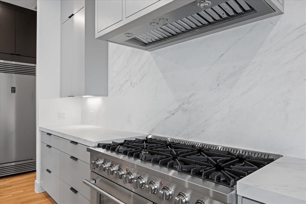 4519 Weldon Street Dallas, TX 75204 - Photo 11 of 40 a close up of a stove top oven sitting inside of a kitchen
