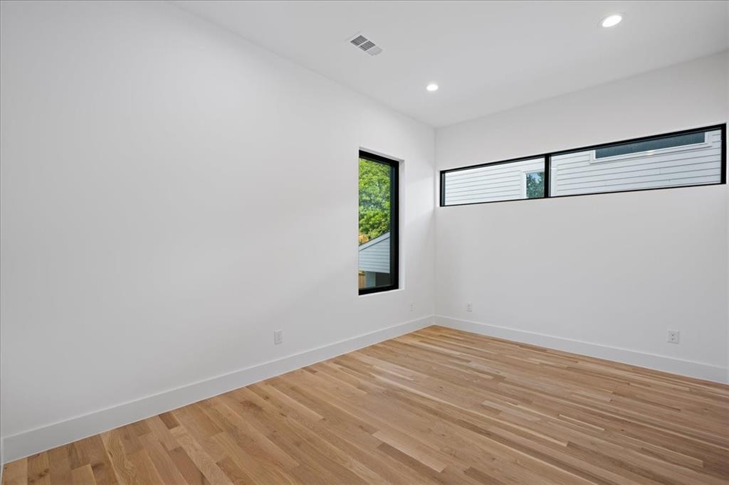 4519 Weldon Street Dallas, TX 75204 - Photo 14 of 40 a view of empty room with wooden floor