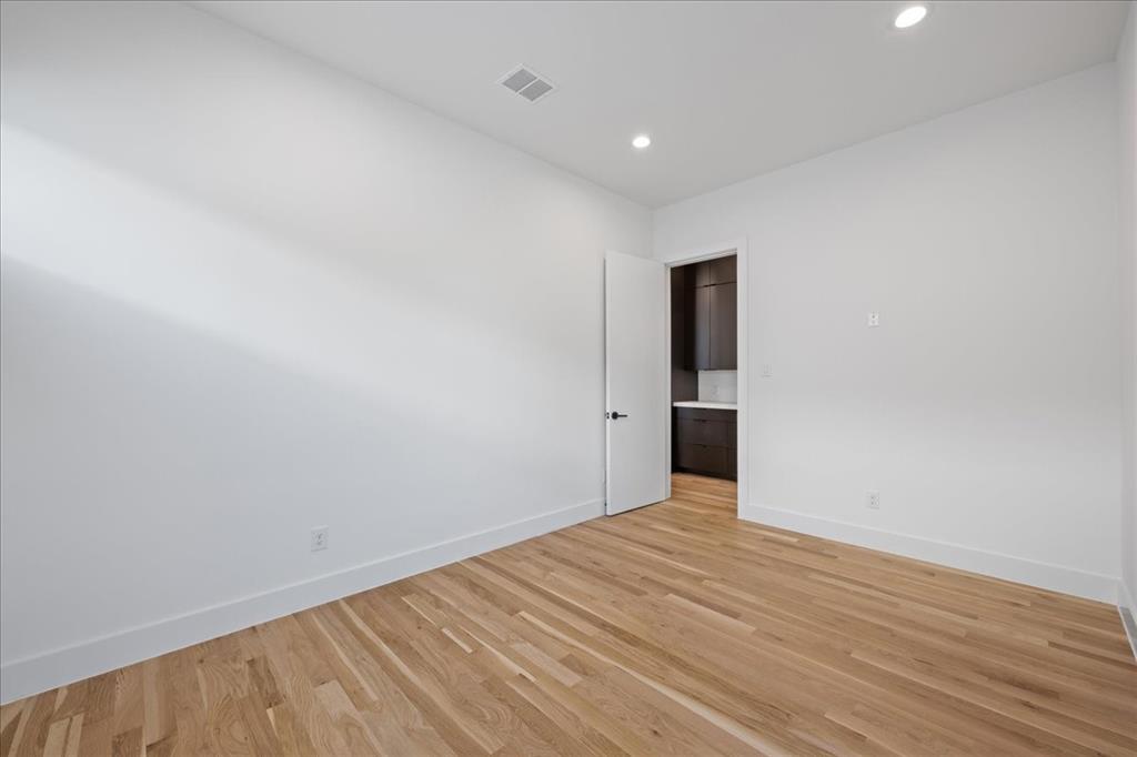 4519 Weldon Street Dallas, TX 75204 - Photo 15 of 40 a view of an empty room with wooden floor