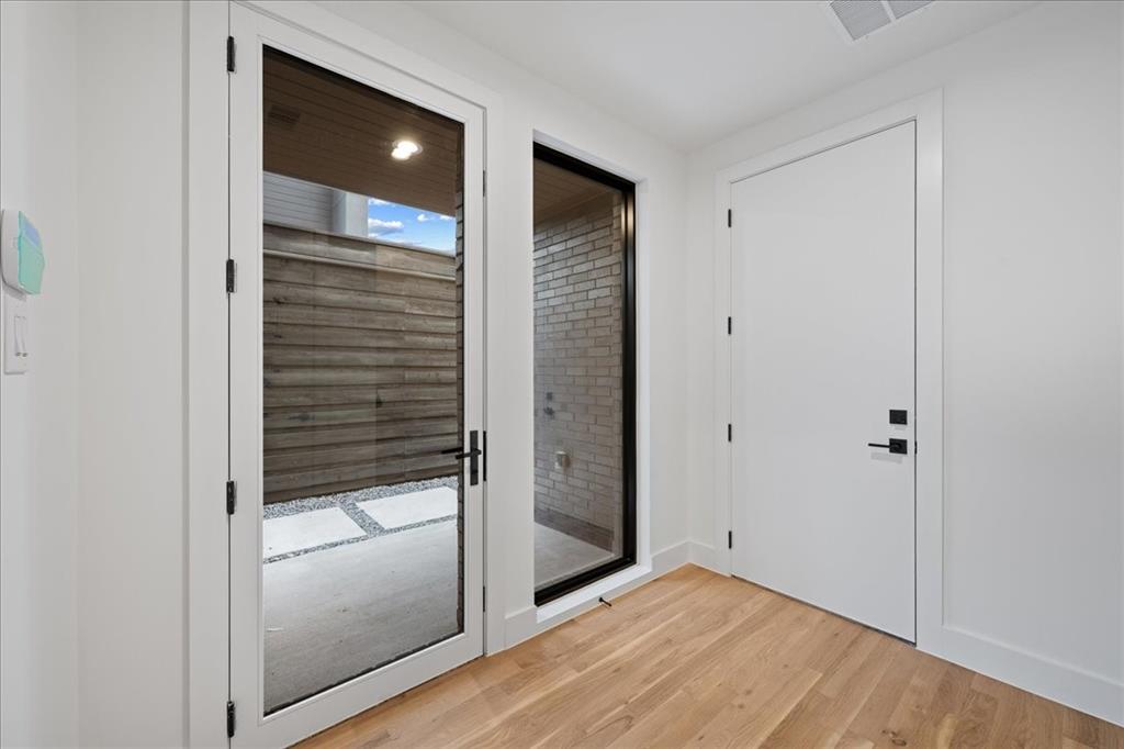 4519 Weldon Street Dallas, TX 75204 - Photo 2 of 40 a view of hallway with wooden floor