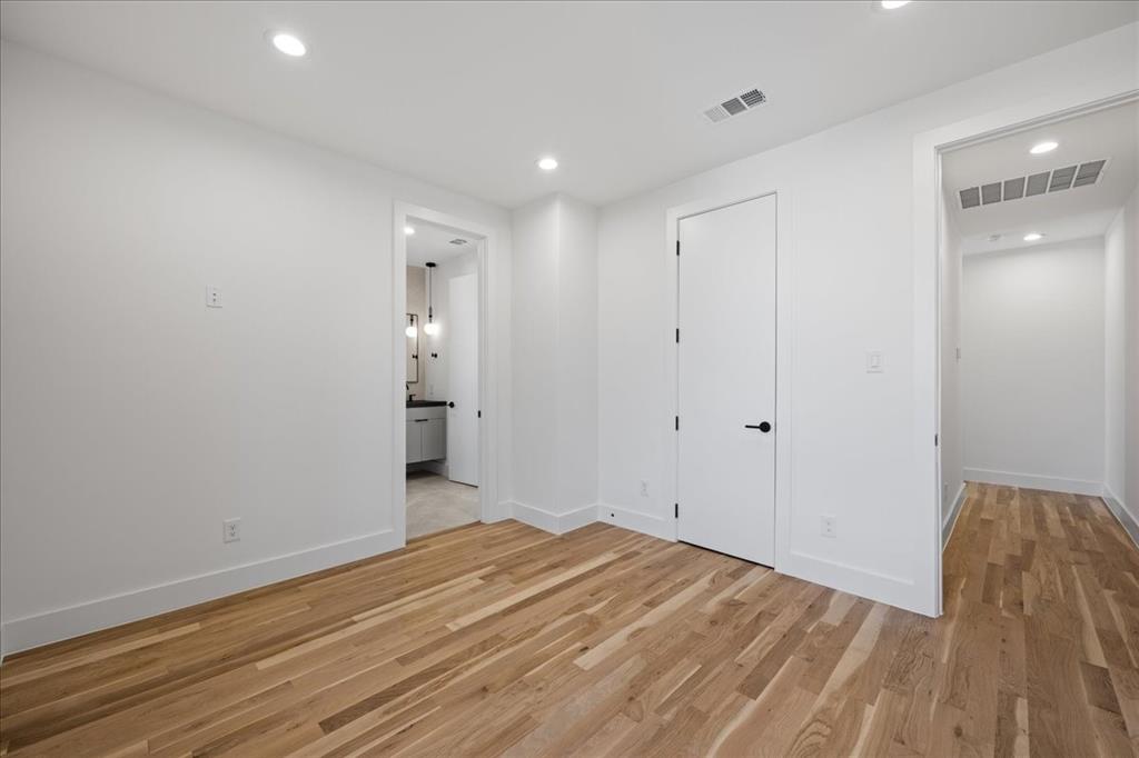 4519 Weldon Street Dallas, TX 75204 - Photo 21 of 40 a view of a room with wooden floor and bathroom