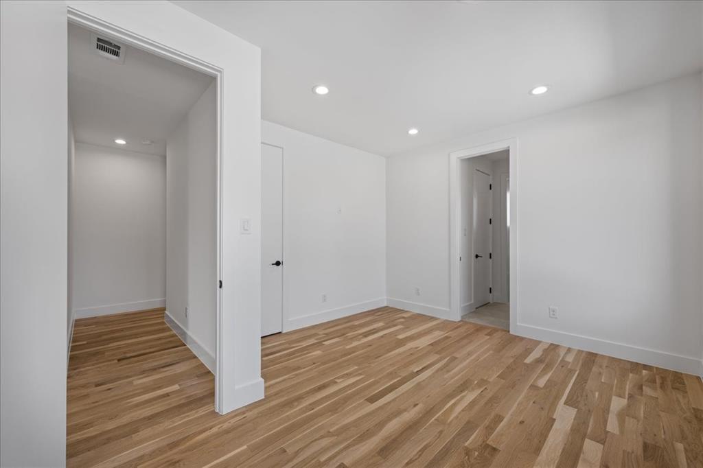 4519 Weldon Street Dallas, TX 75204 - Photo 25 of 40 a view of a hallway with wooden floor