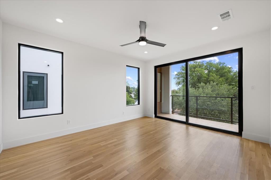 4519 Weldon Street Dallas, TX 75204 - Photo 28 of 40 a view of an empty room with wooden floor and a window