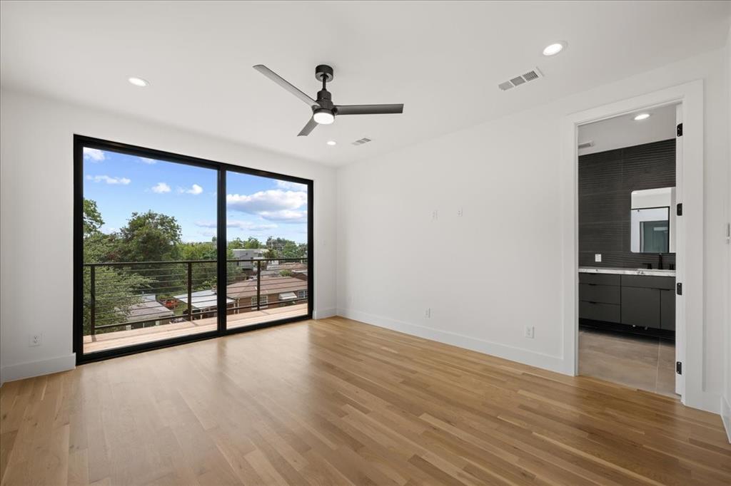 4519 Weldon Street Dallas, TX 75204 - Photo 29 of 40 a view of a room with wooden floor and sliding glass door