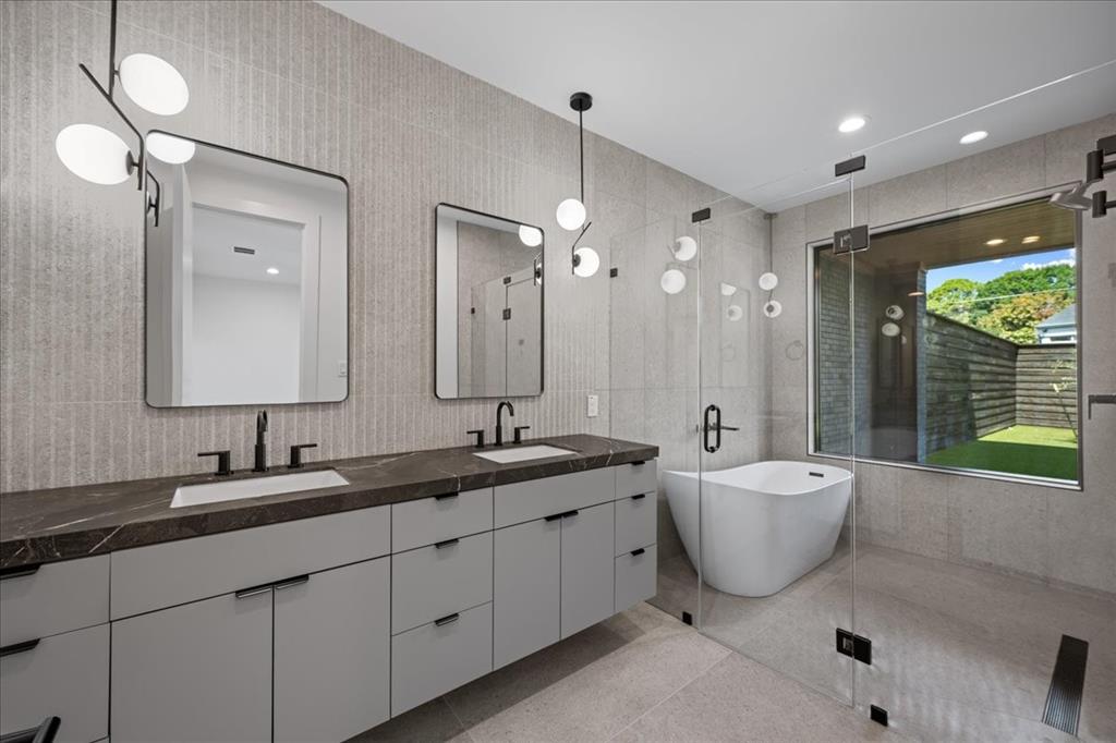 4519 Weldon Street Dallas, TX 75204 - Photo 5 of 40 a spacious bathroom with a double vanity sink mirror and double