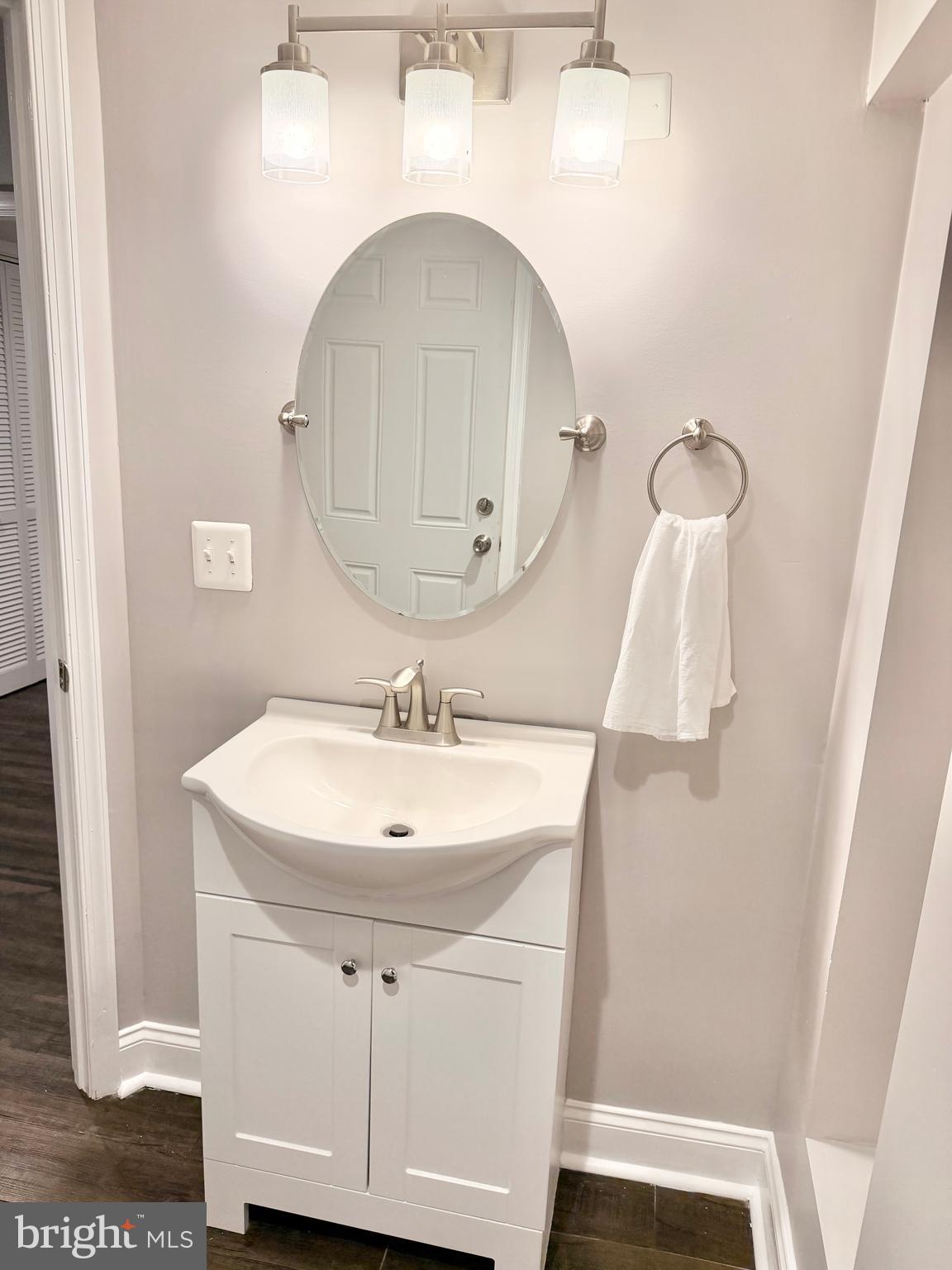 2235 Southorn Road Baltimore, MD 21220 - Photo 27 of 33 a bathroom with a sink and mirror