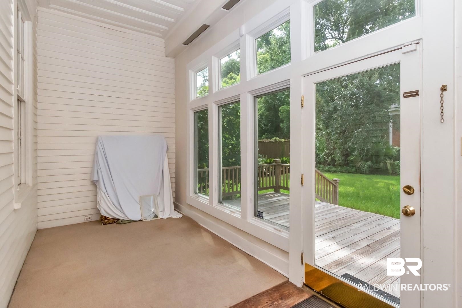 959 Dauphin Street Mobile, AL 36604 - Photo 17 of 43 Doorway with carpet floors and a wealth of natural light