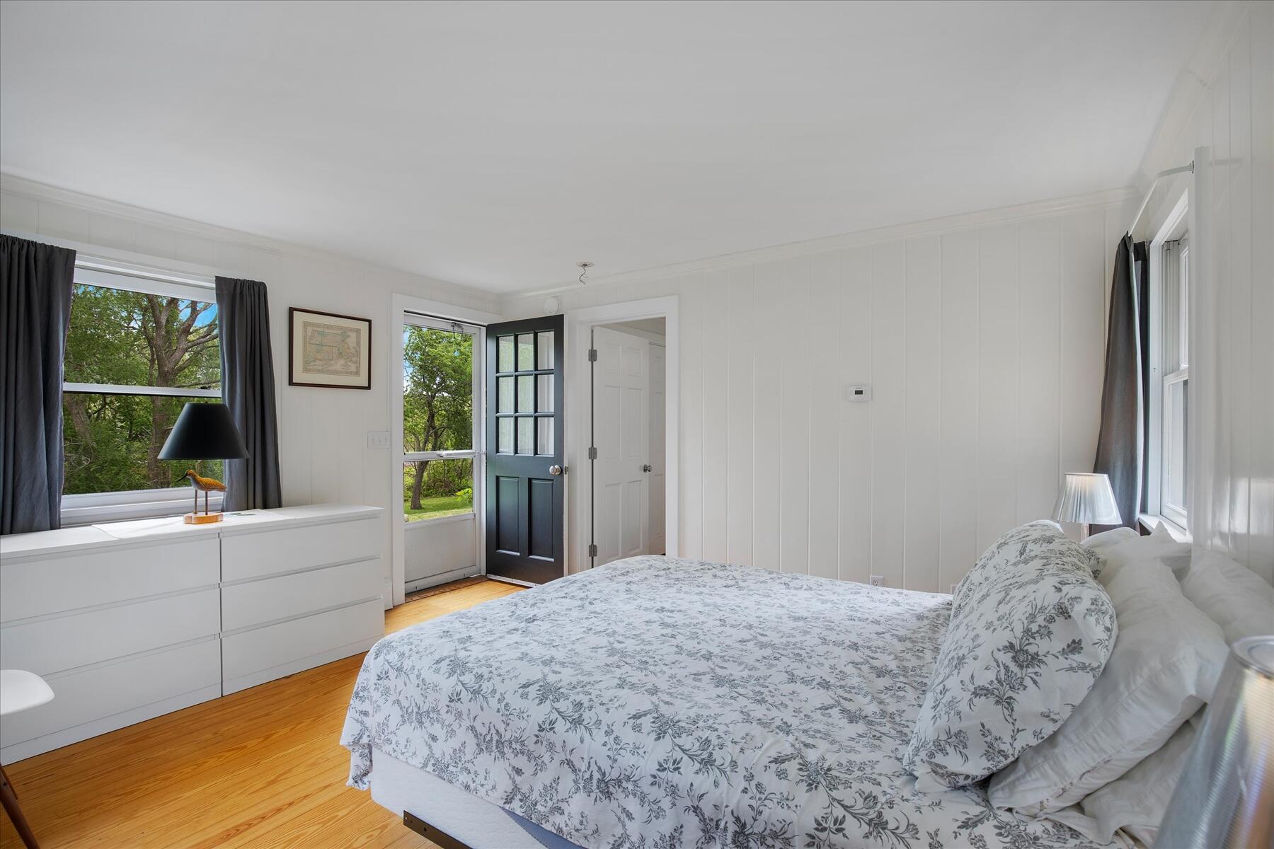 21 Quaker Road East Sandwich, MA 02537 - Photo 32 of 43 a bedroom with a bed and a large window