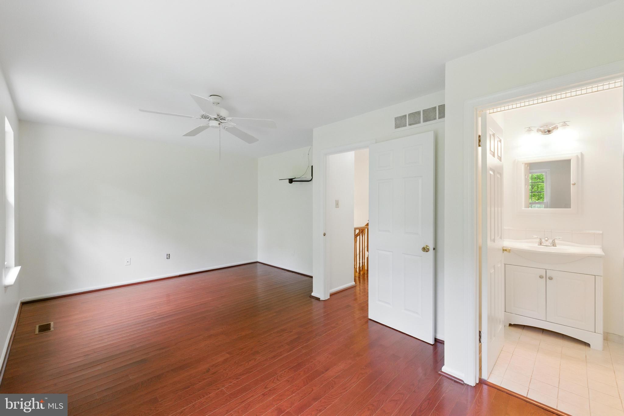 72 Carousel Circle Doylestown, PA 18901 - Photo 15 of 22 an empty room with wooden floor and windows