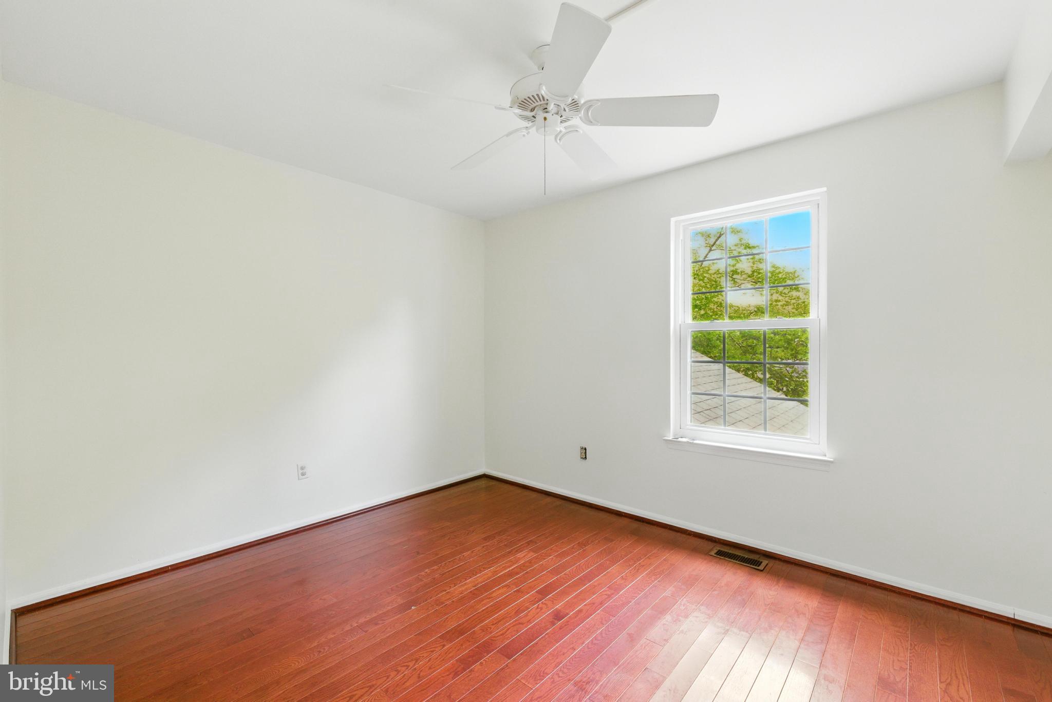 72 Carousel Circle Doylestown, PA 18901 - Photo 18 of 22 an empty room with a window and wooden floor