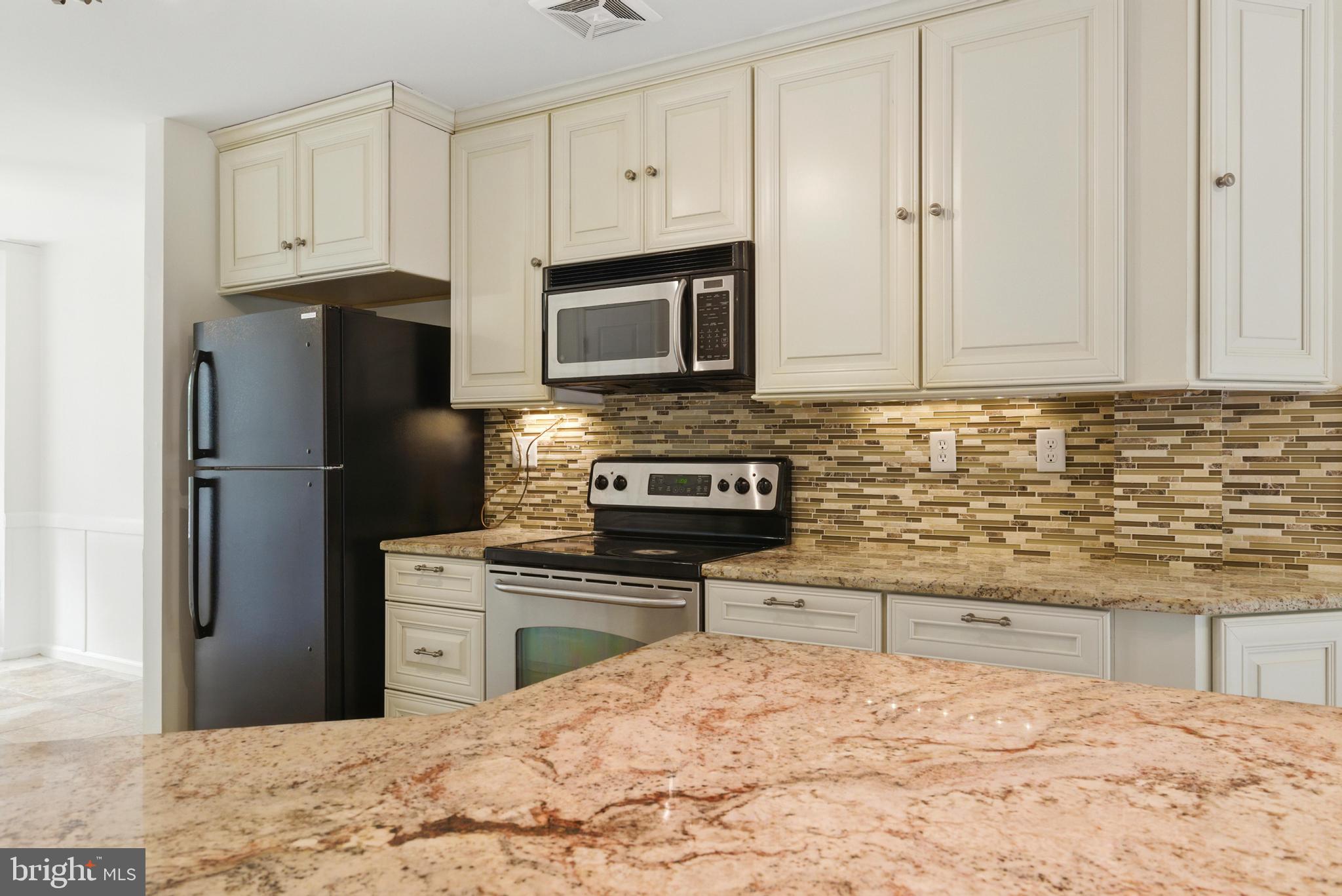 72 Carousel Circle Doylestown, PA 18901 - Photo 8 of 22 a kitchen with stainless steel appliances granite countertop a refrigerator stove top oven and sink