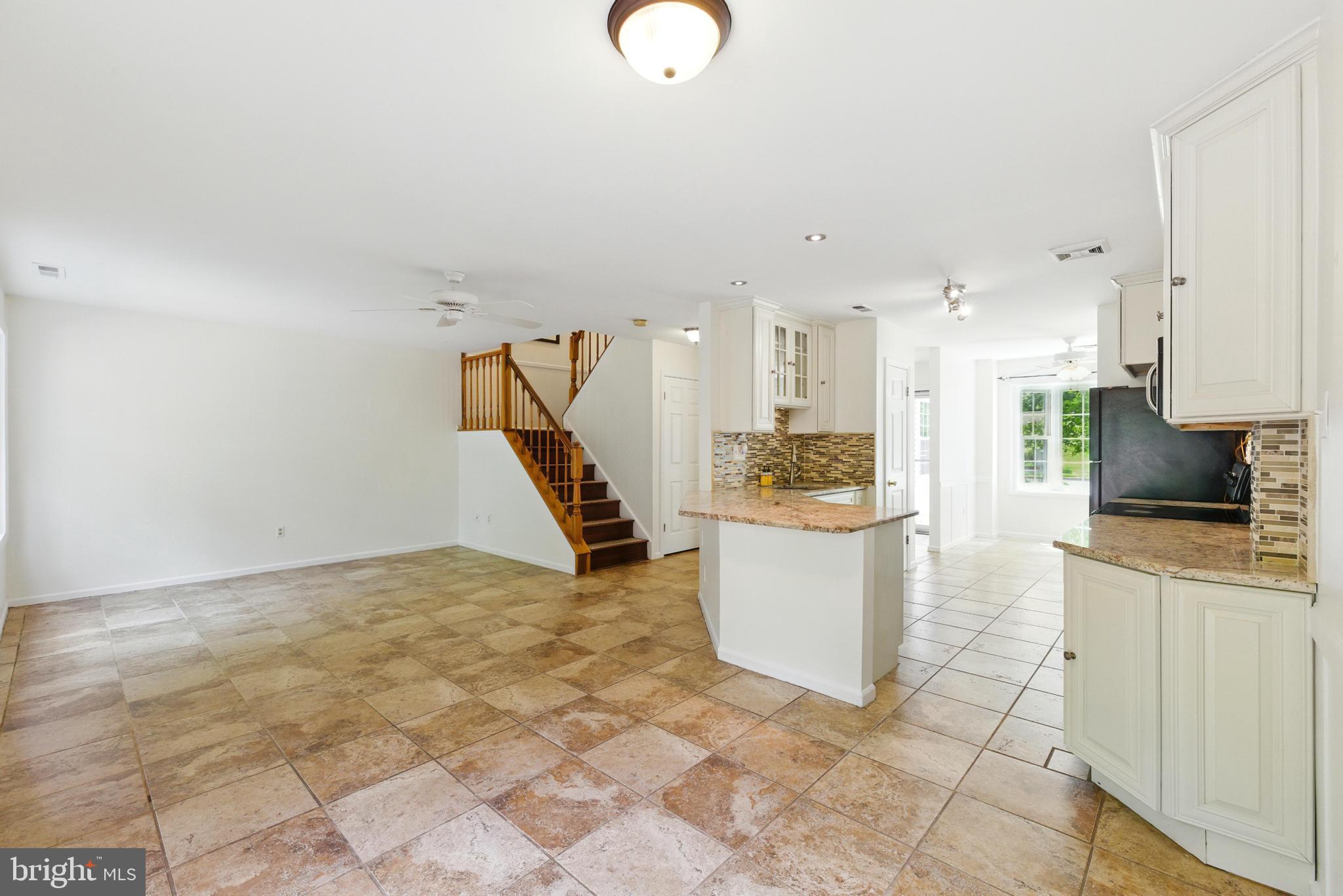 72 Carousel Circle Doylestown, PA 18901 - Photo 9 of 22 a kitchen with a refrigerator and a stove top oven