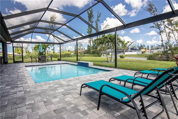 a view of swimming pool with a backyard