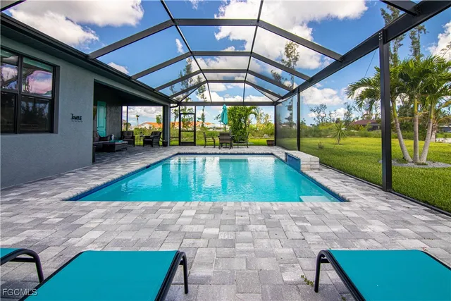 a view of swimming pool with a yard