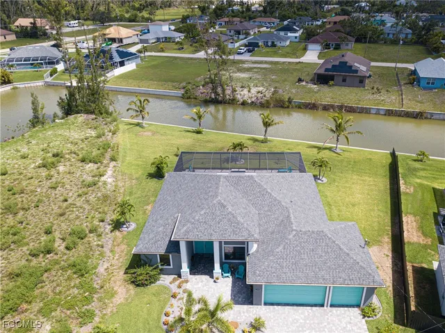 an aerial view of a house with a ocean view