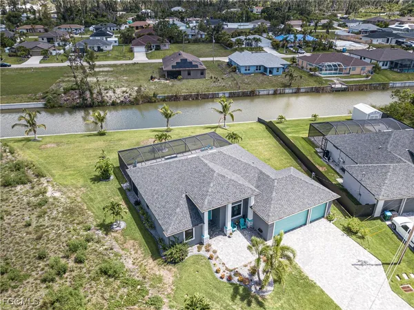 an aerial view of a house with a lake view