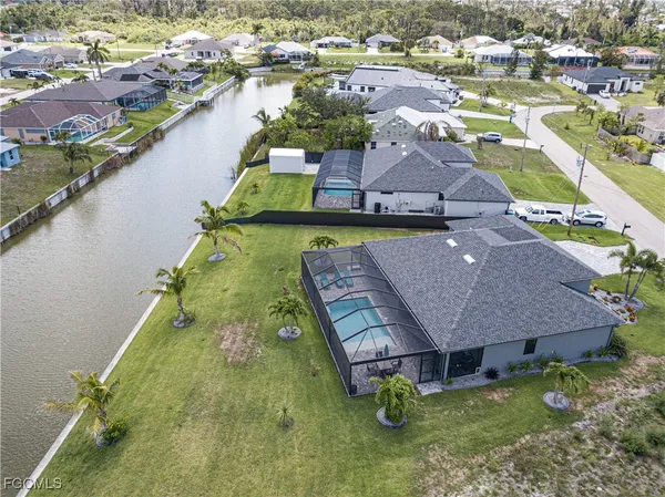 a aerial view of a house with a lake view