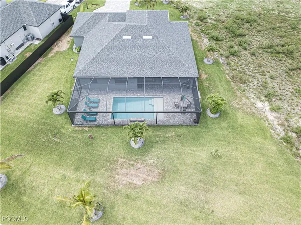 a aerial view of a house with a yard
