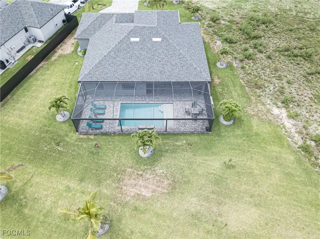 a aerial view of a house with a yard