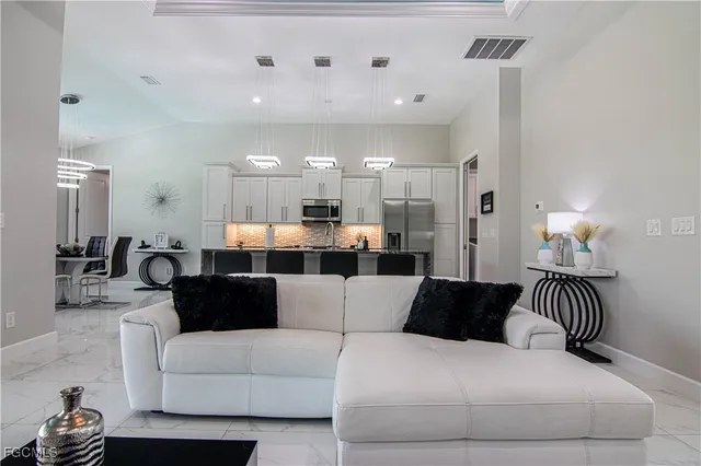 a living room with furniture and a large mirror