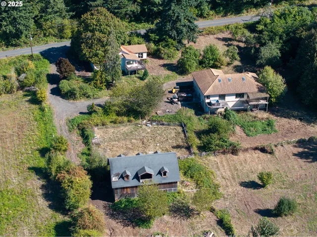 an aerial view of a houses with outdoor space and street view