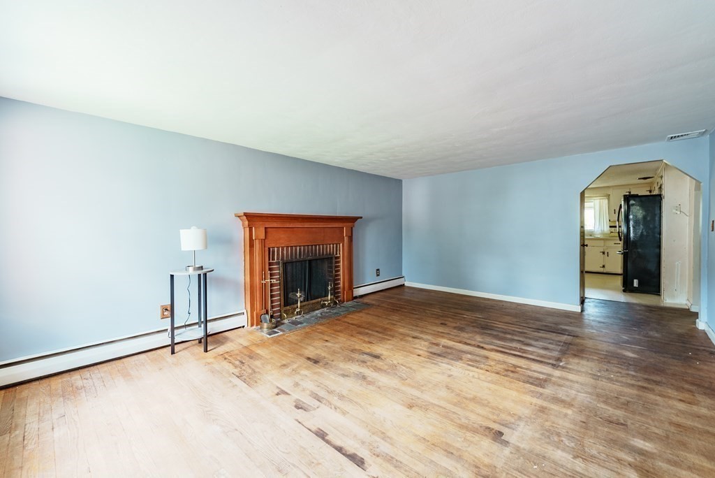 96 Strong Street Springfield, MA 01104 - Photo 8 of 33 a view of empty room with a fireplace