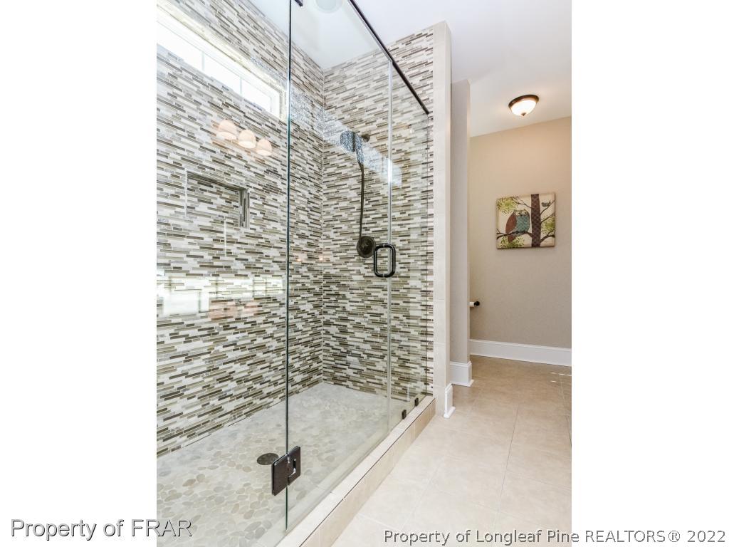 5491 Murphy Road Stedman, NC 28391 - Photo 17 of 33 a bathroom with a shower and a sink