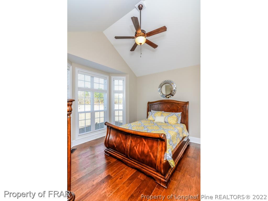 5491 Murphy Road Stedman, NC 28391 - Photo 18 of 33 a bedroom with a bed and window