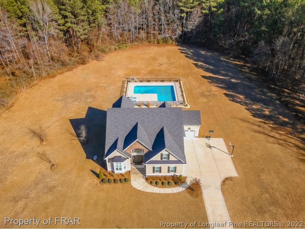 5491 Murphy Road Stedman, NC 28391 - Photo 2 of 33 a view of the house with a yard