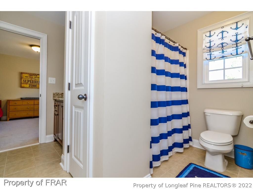5491 Murphy Road Stedman, NC 28391 - Photo 24 of 33 a bathroom with a sink and a toilet