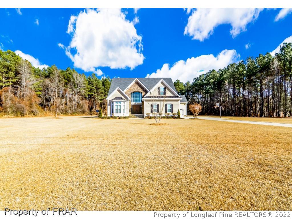 5491 Murphy Road Stedman, NC 28391 - Photo 29 of 33 a view of swimming pool with an outdoor space and seating area