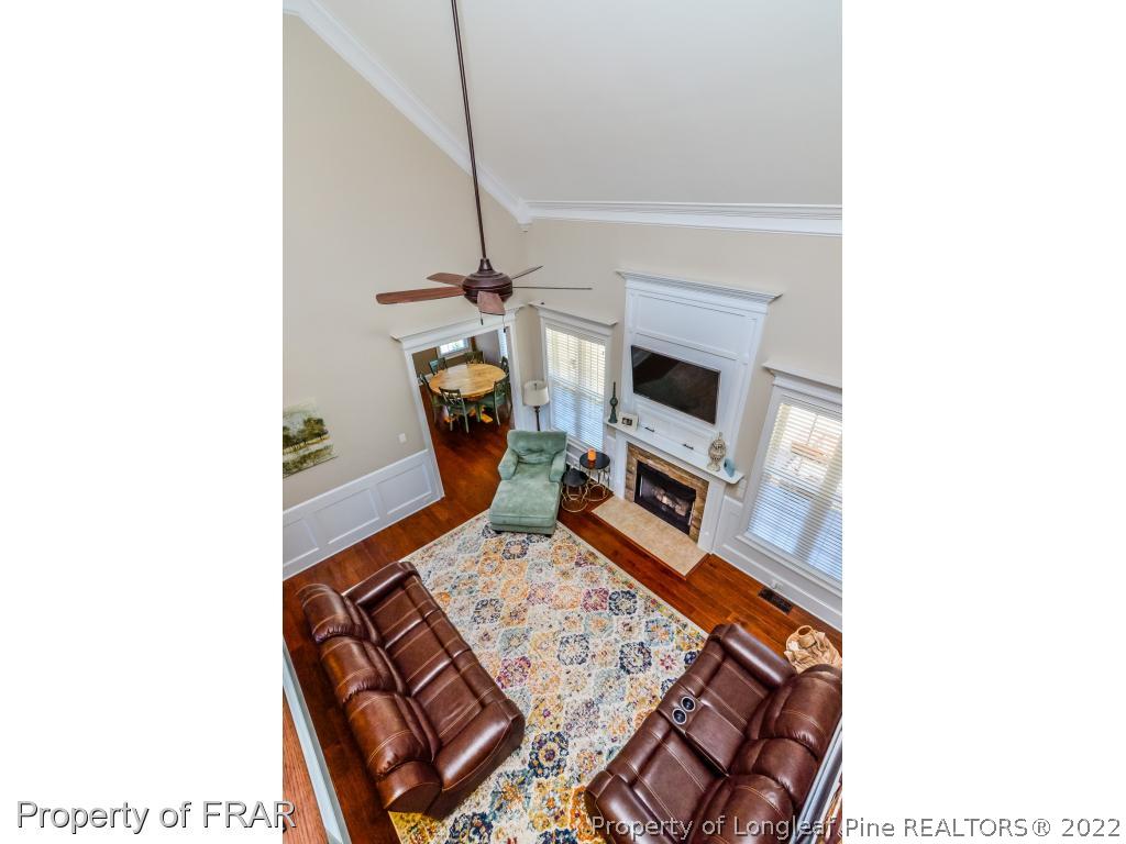 5491 Murphy Road Stedman, NC 28391 - Photo 6 of 33 a living room with furniture and a fireplace