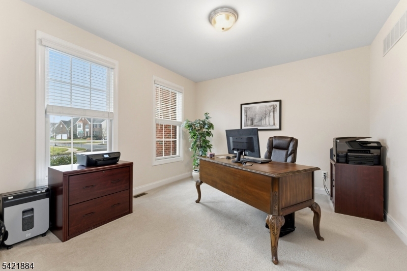 26 Rouser Way Hillsborough, NJ 08844 - Photo 23 of 49 a view of a workspace with furniture and a window