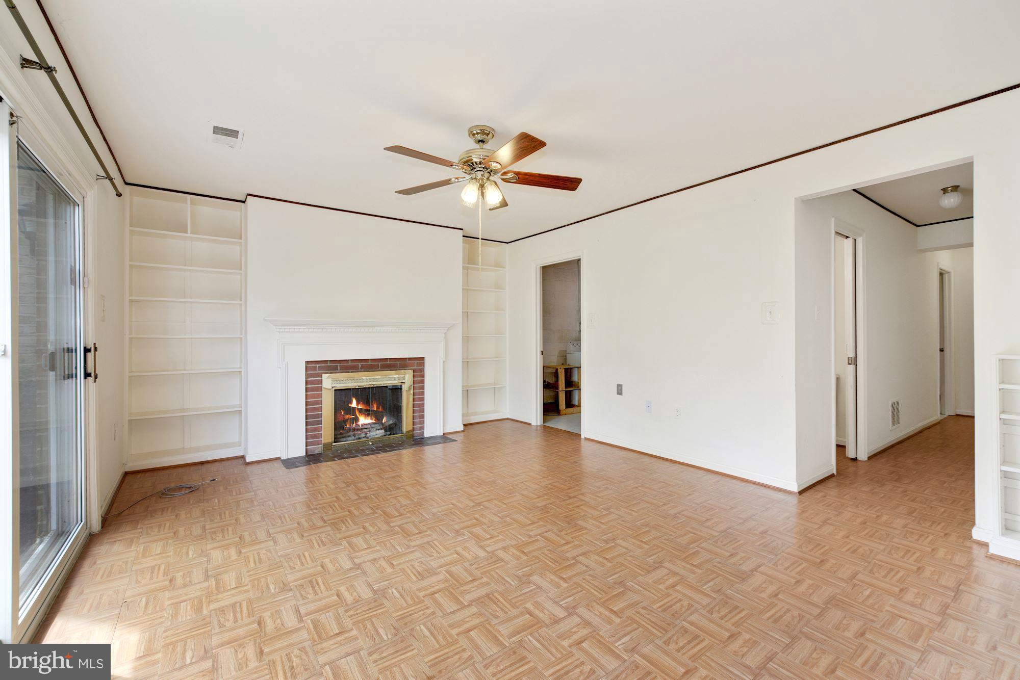 2123 Bucknell Terrace, Unit 52 Silver Spring, MD 20902 - Photo 17 of 26 Family Room w/ Built-Ins & Fireplace - Lower Level