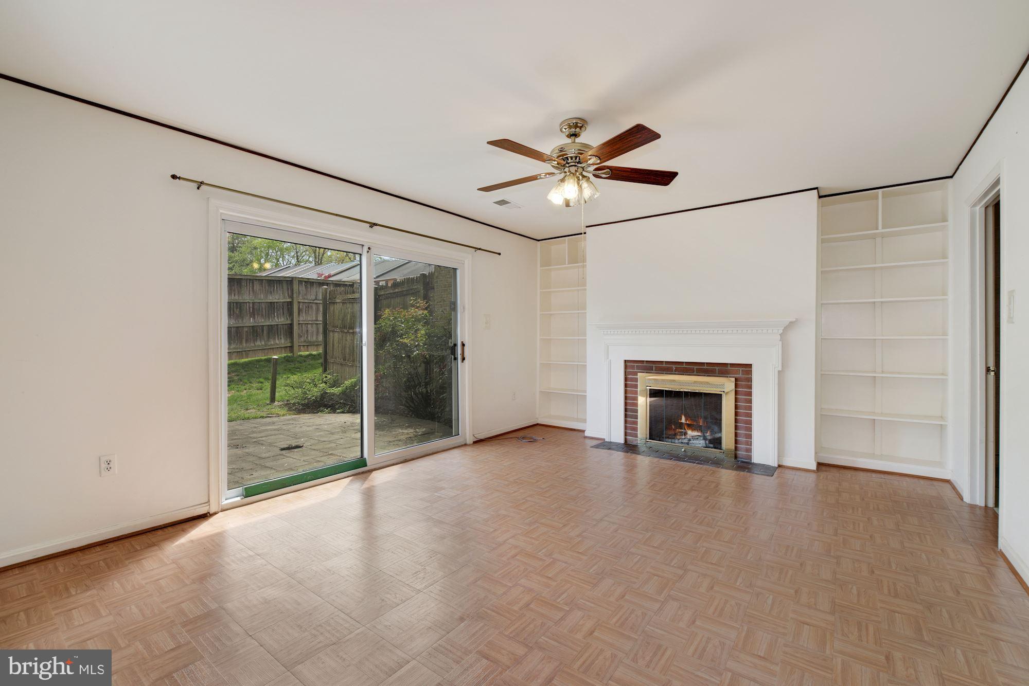 2123 Bucknell Terrace, Unit 52 Silver Spring, MD 20902 - Photo 18 of 26 Family Room w/ Built-Ins & Fireplace - Lower Level
