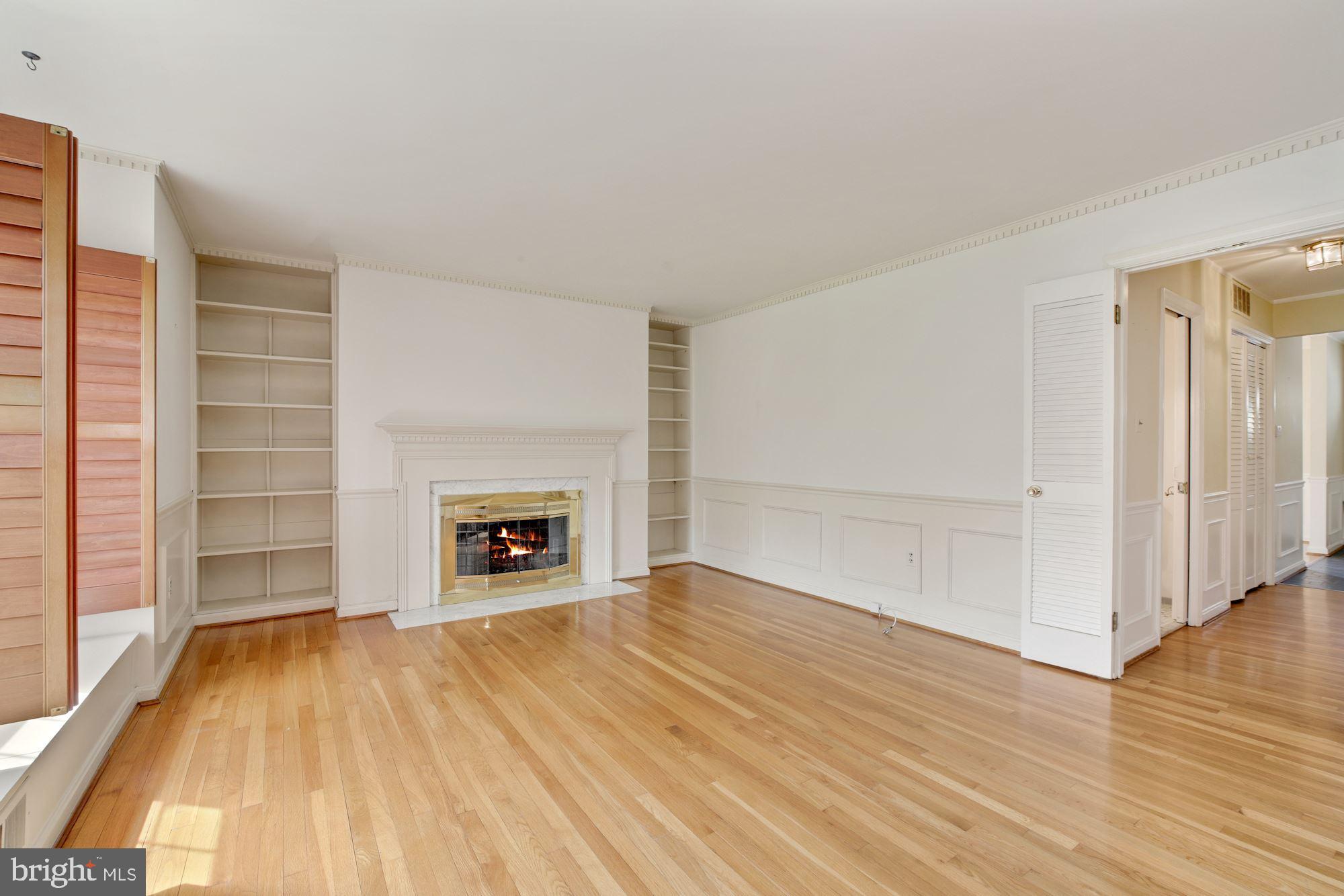 2123 Bucknell Terrace, Unit 52 Silver Spring, MD 20902 - Photo 7 of 26 Living Room w/ Built-Ins & Fireplace - Main Level