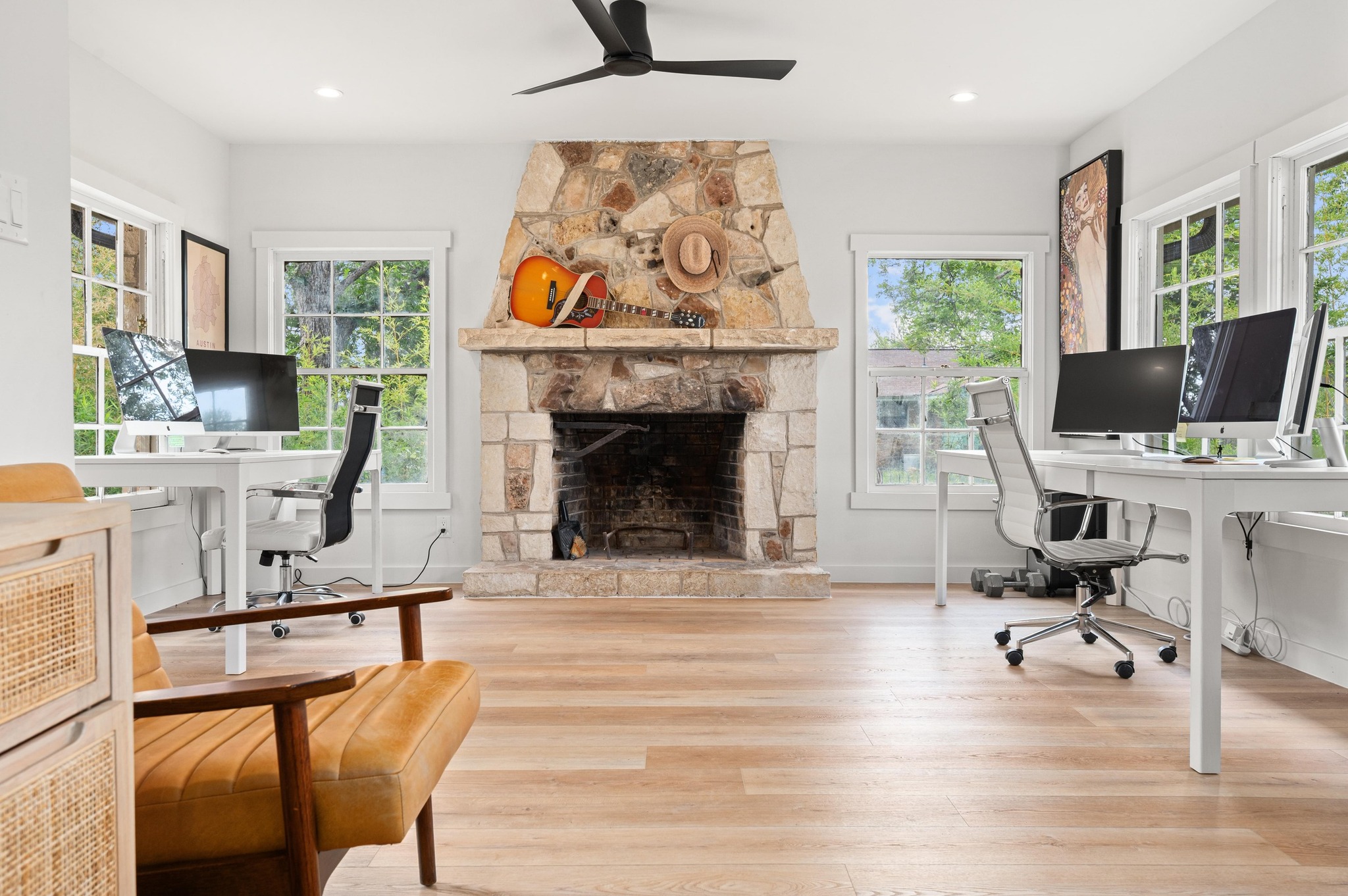 3501 Pecan Springs Road Austin, TX 78723 - Photo 22 of 40 Office with a stone fireplace, wood finished floors, a ceiling fan, and recessed lighting