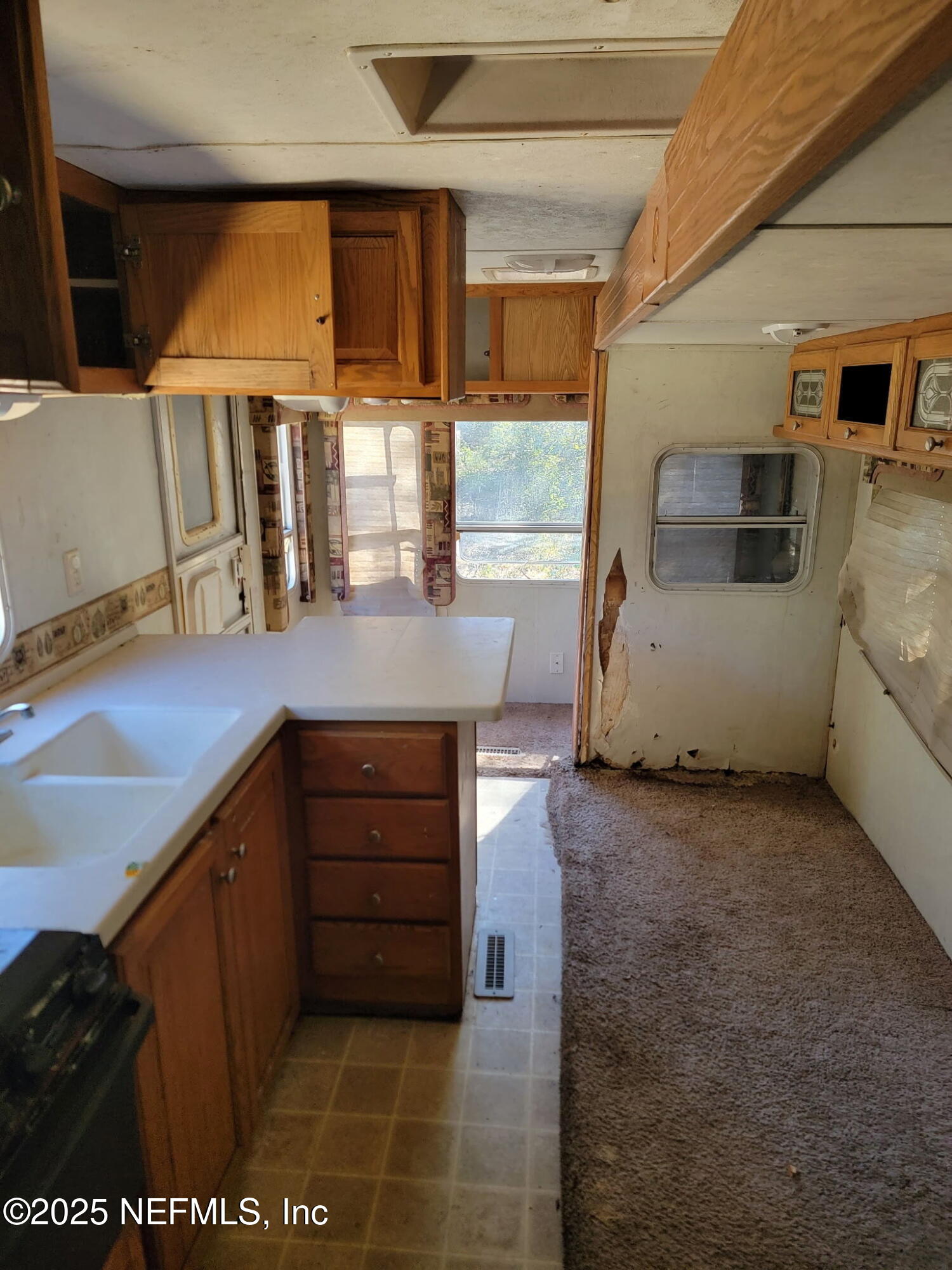 333 2nd Way Interlachen, FL 32148 - Photo 11 of 13 a kitchen with sink and window
